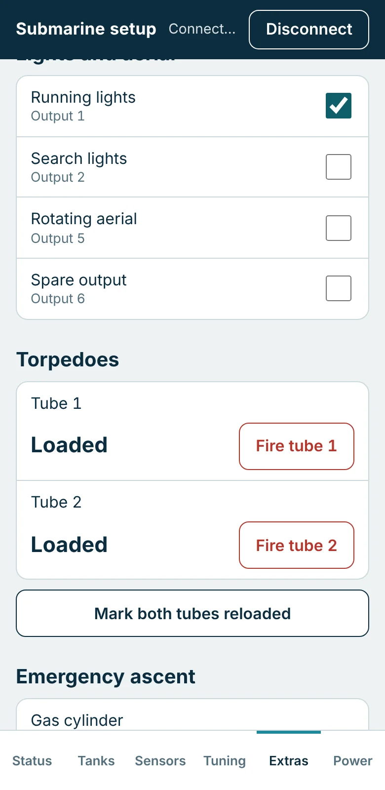 Setup page, Extras tab: switches for running lights, search lights, rotating aerial and spare output, and Fire buttons for two loaded torpedo tubes.